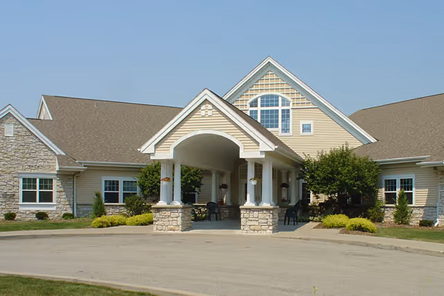 Exterior view of Brookdale Williamsville senior living facility entrance with landscaping
