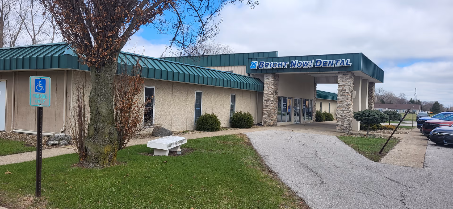 Exterior view of Cambridge Home Health Care in Sandusky with Bright Now! Dental sign