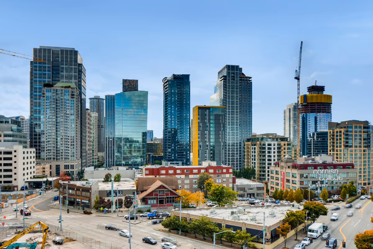 Downtown Seattle skyline with glass towers and busy streets.