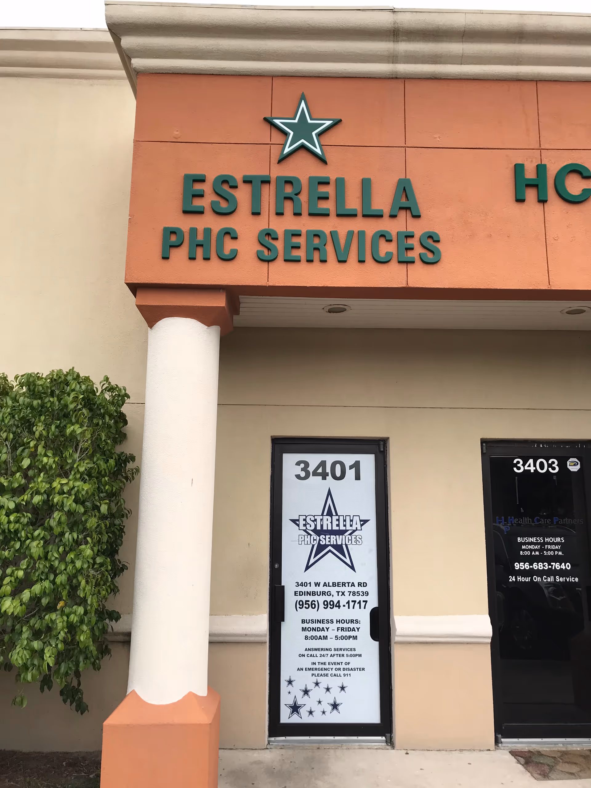 Exterior view of Estrella PHC Services building entrance with sign and doorway.