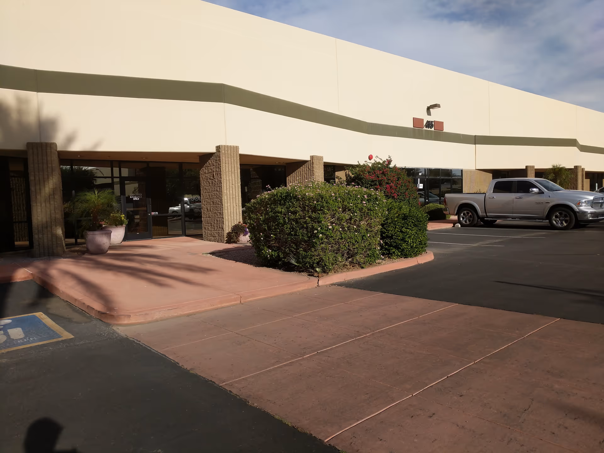 Exterior of a Soleo Health facility with a parking lot and entrance.