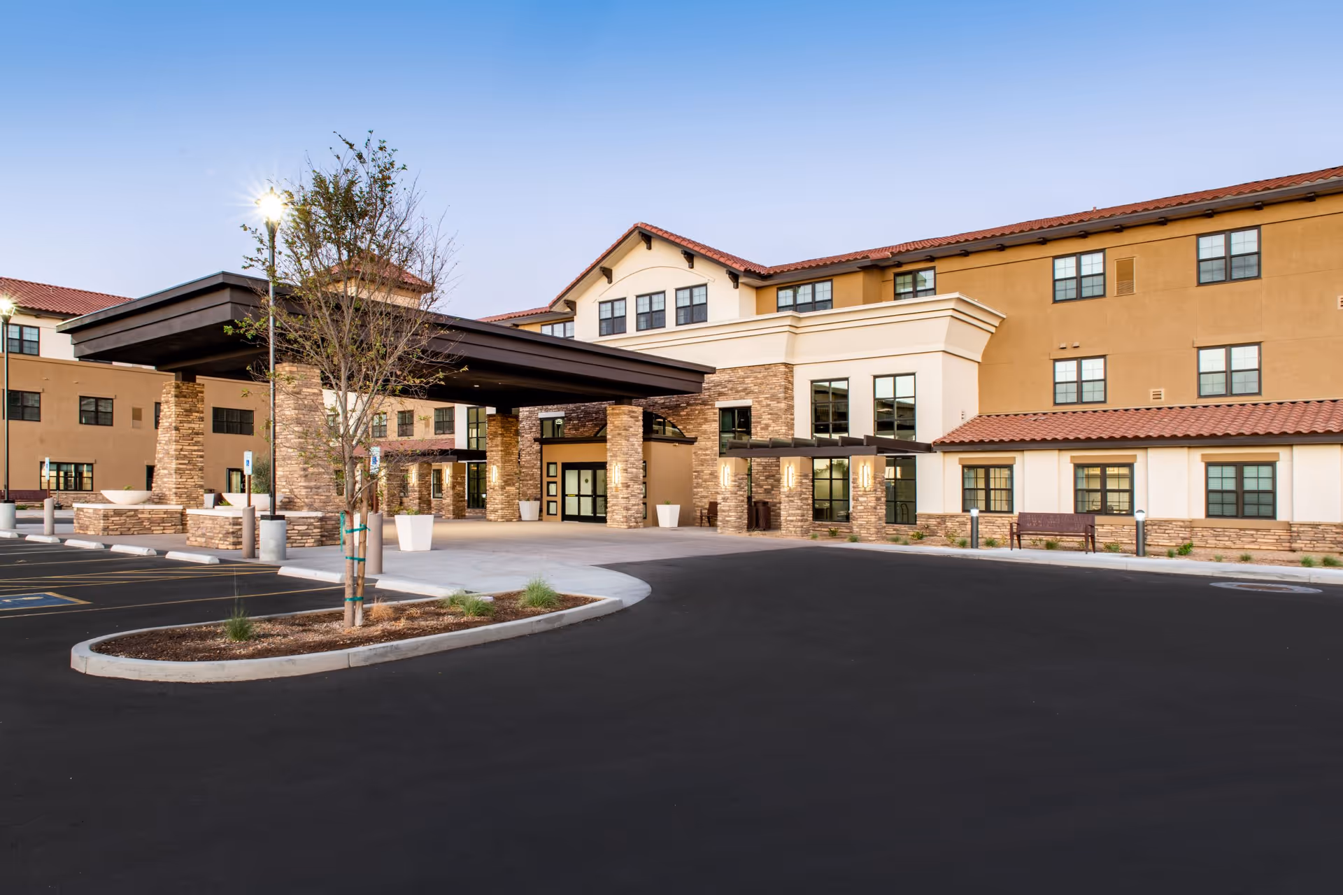 Exterior view of Clarendale of Chandler with a covered entrance and circular driveway.