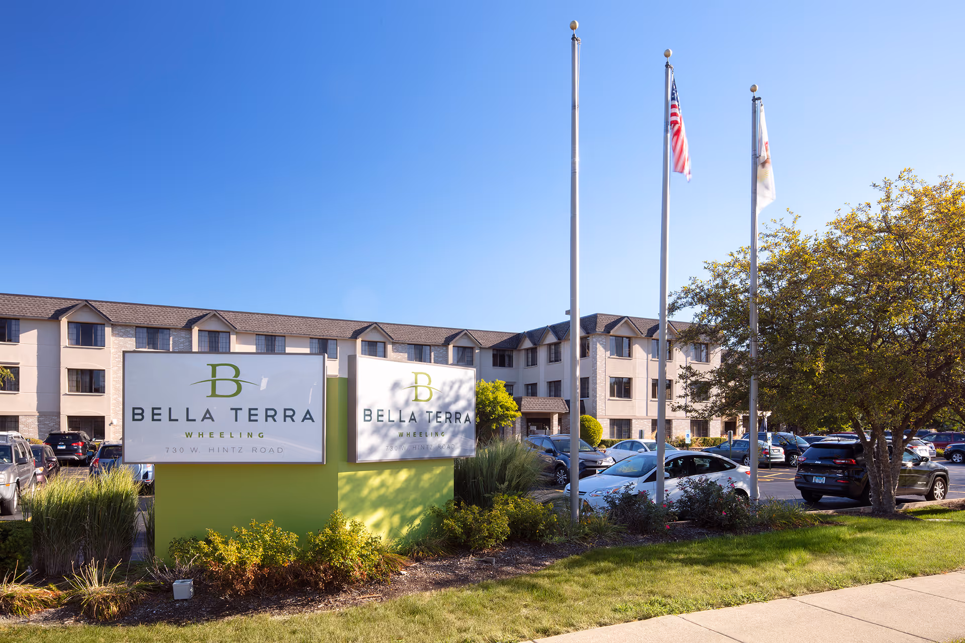 Exterior view of Bella Terra Wheeling with building frontage, signage, and a parking lot.