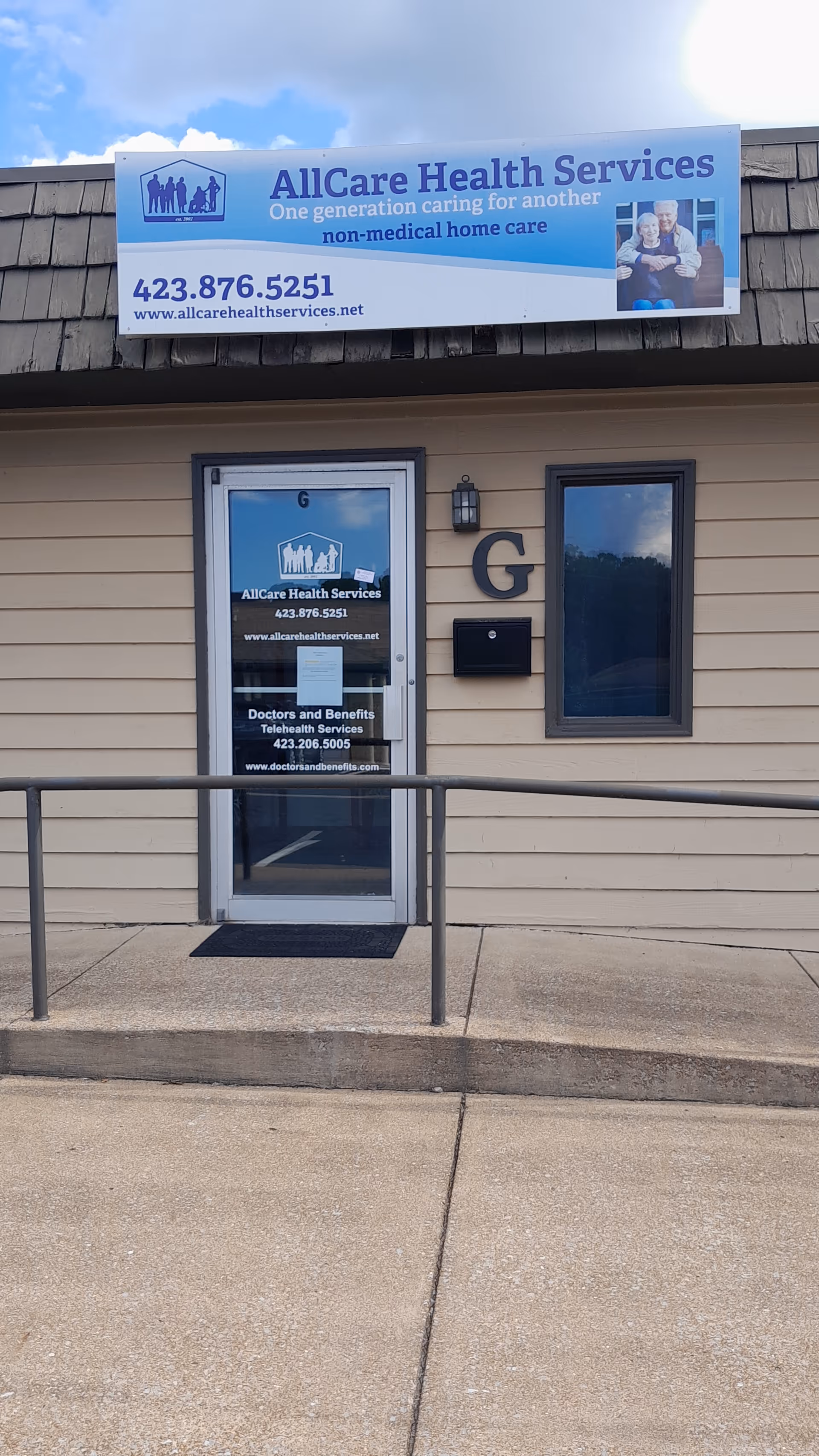 Front exterior of AllCare Health Services building with entrance door and sign.