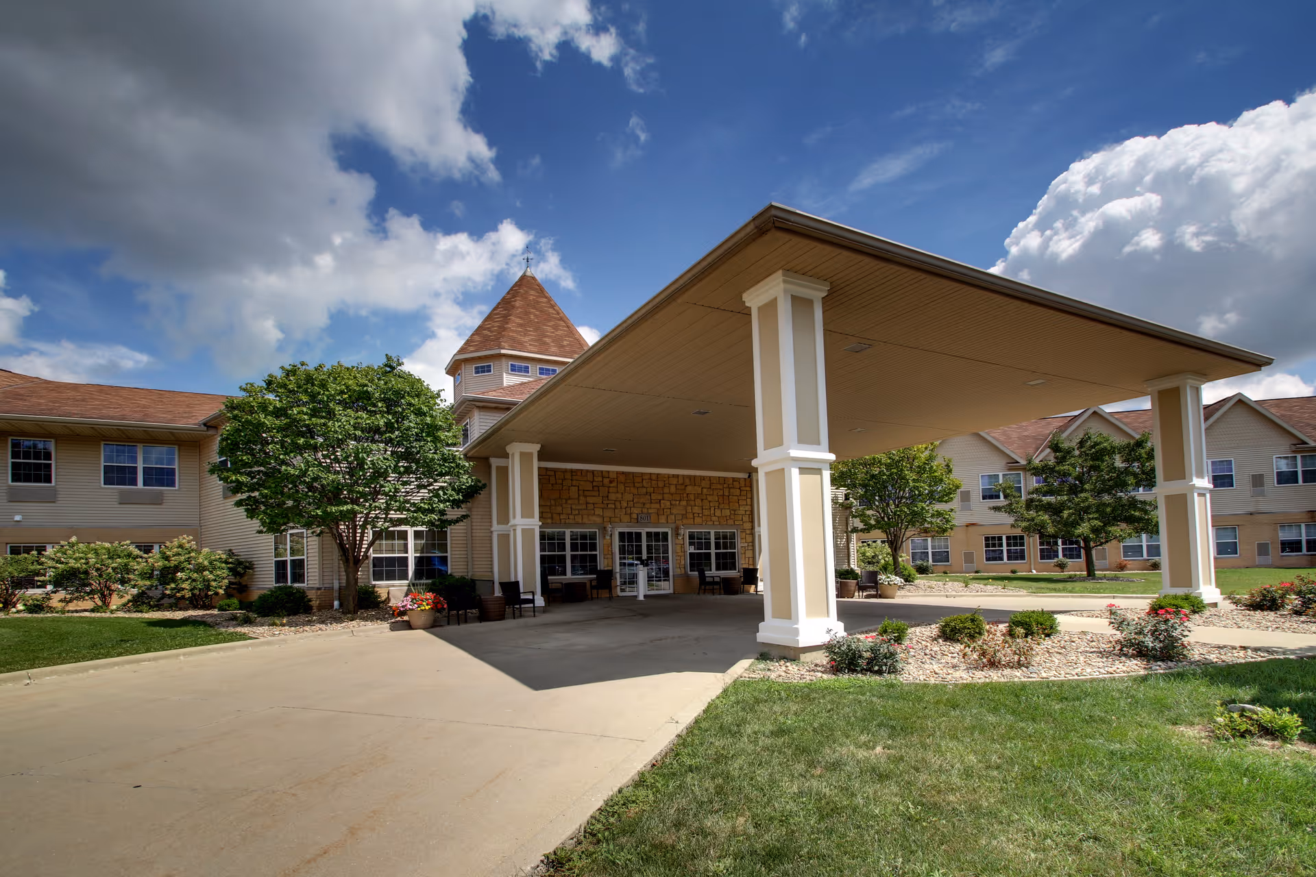 Exterior of Evergreen Senior Living with a covered entrance and landscaped grounds.