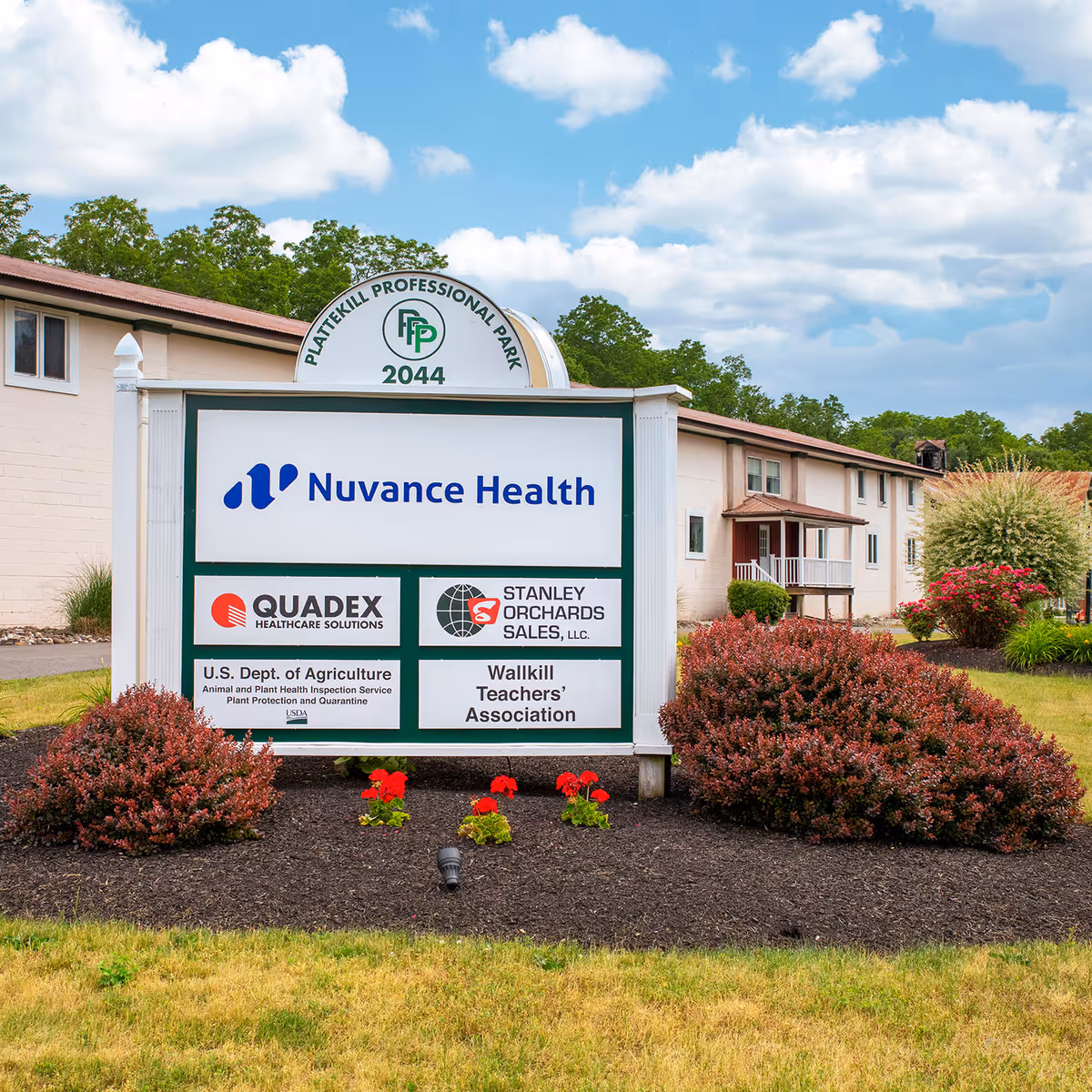 Exterior view of a Nuvance Health sign in front of the Modena clinic with landscaping