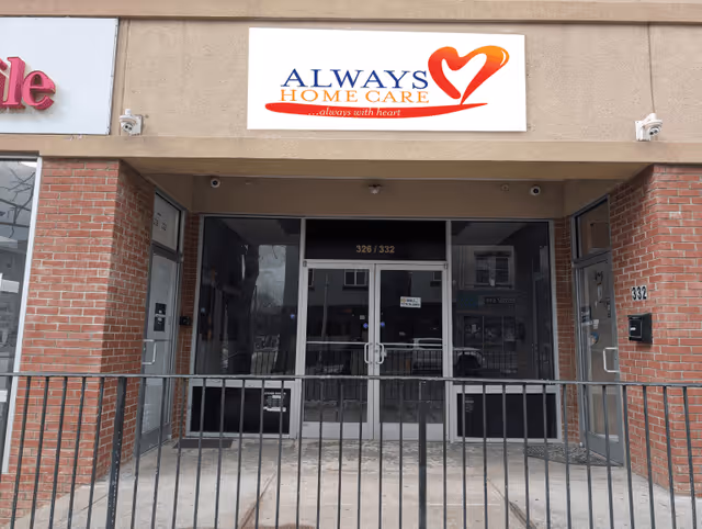 Facade of a senior care facility with glass entrance and Always Home Care sign.