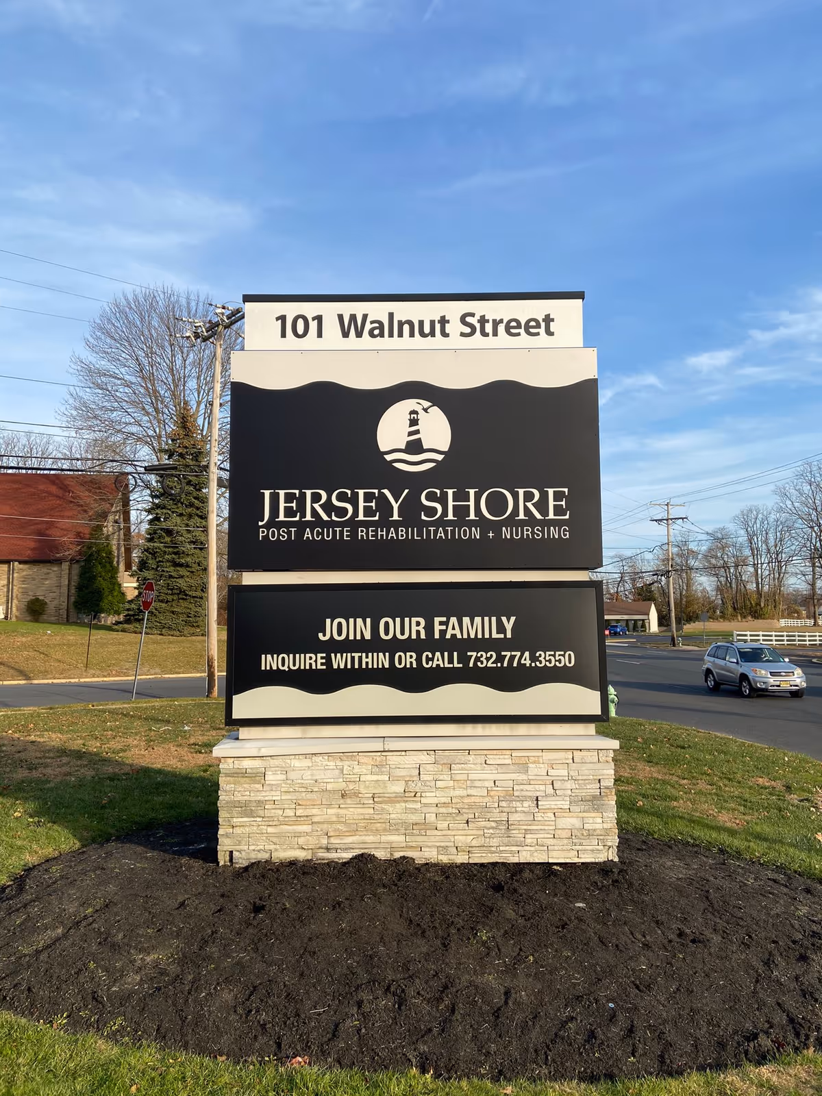 A large exterior sign for Jersey Shore Post Acute Rehabilitation and Nursing at 101 Walnut Street.