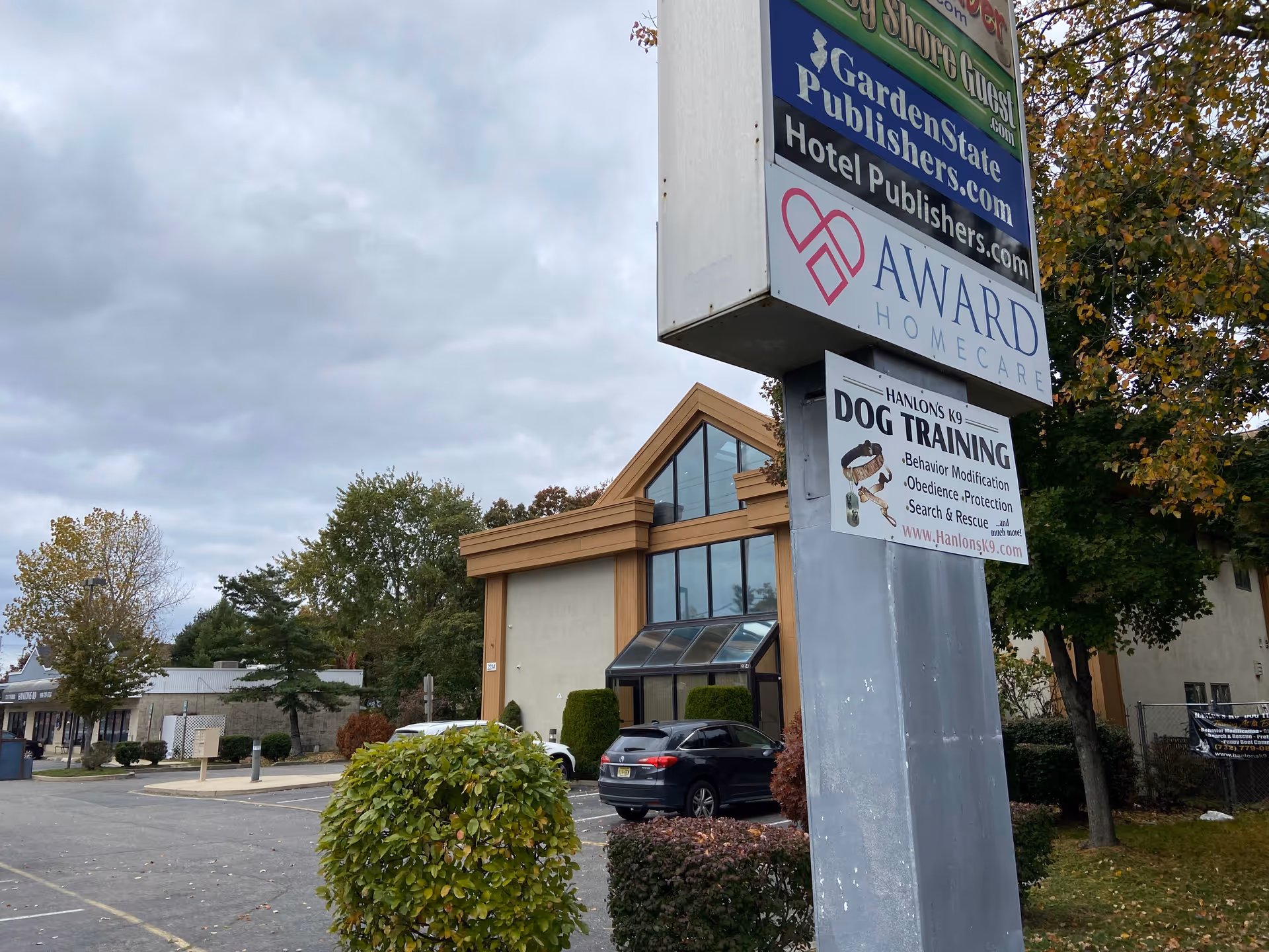 Exterior view of a senior care building with a large sign reading Award Homecare.