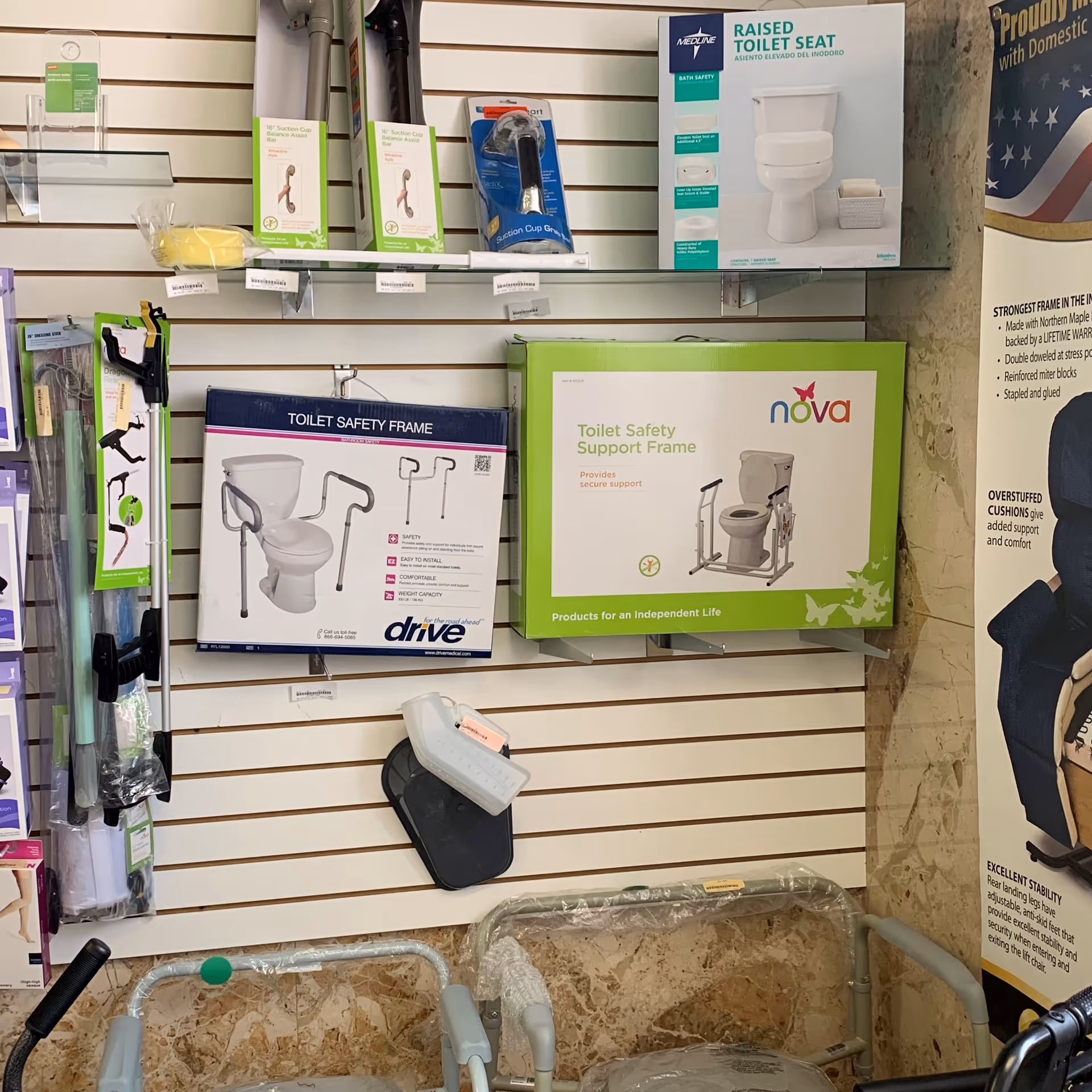 Slatwall display with bathroom safety products and toilet aids in a home care showroom