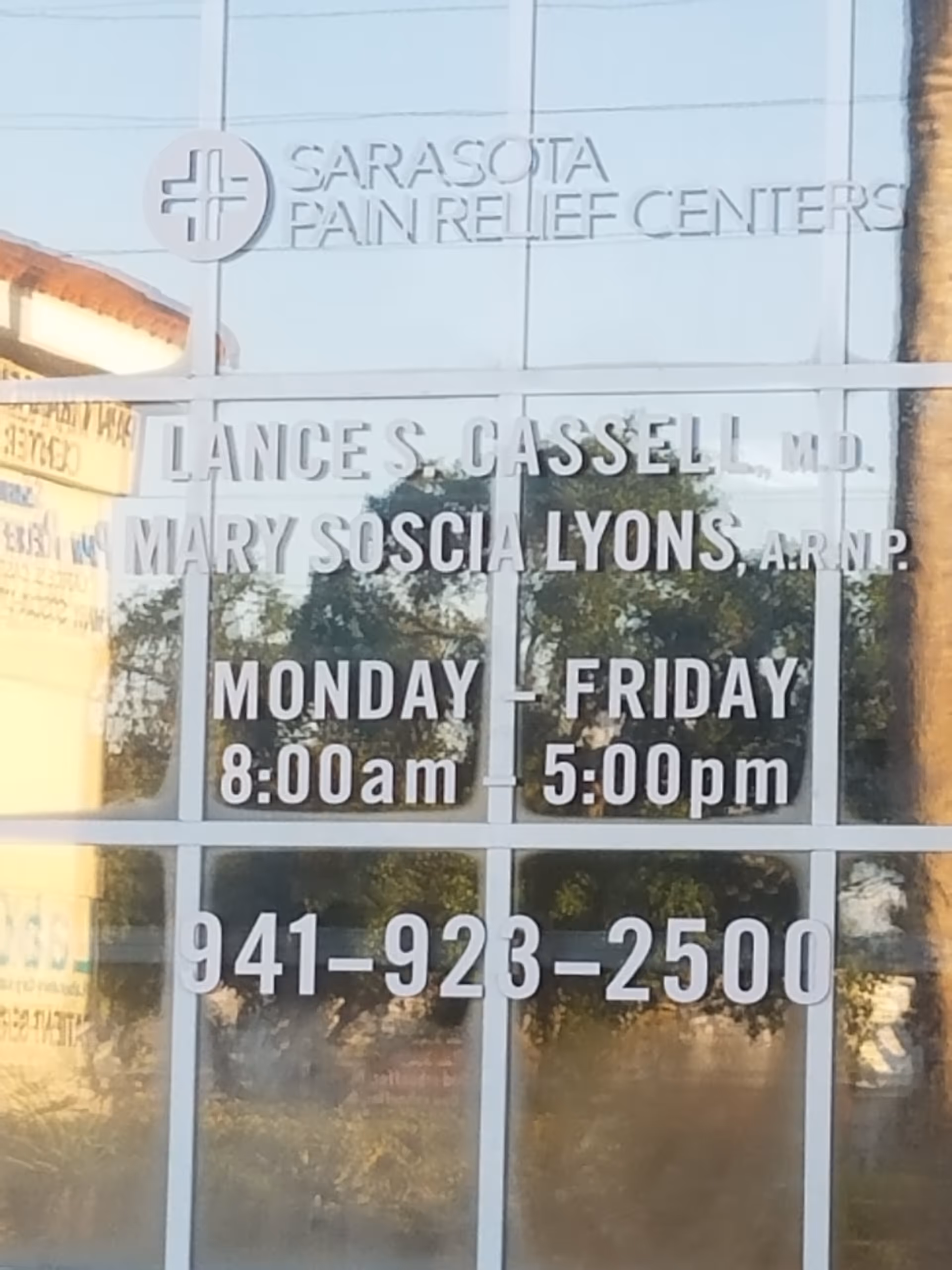 Front of Sarasota Pain Relief Centers building with glass windows and signage