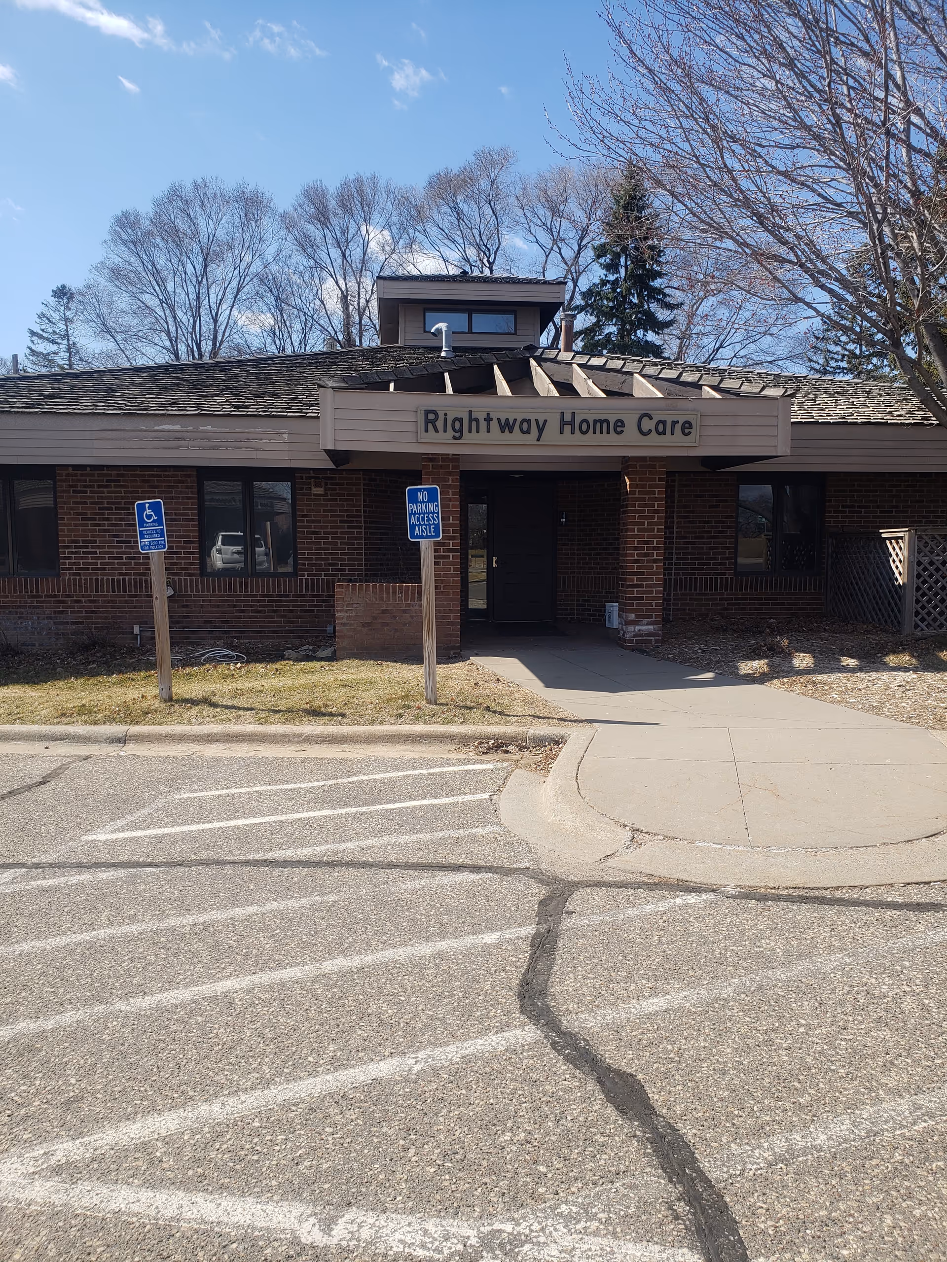 Front exterior view of Rightway Home Care building with sign and parking area.