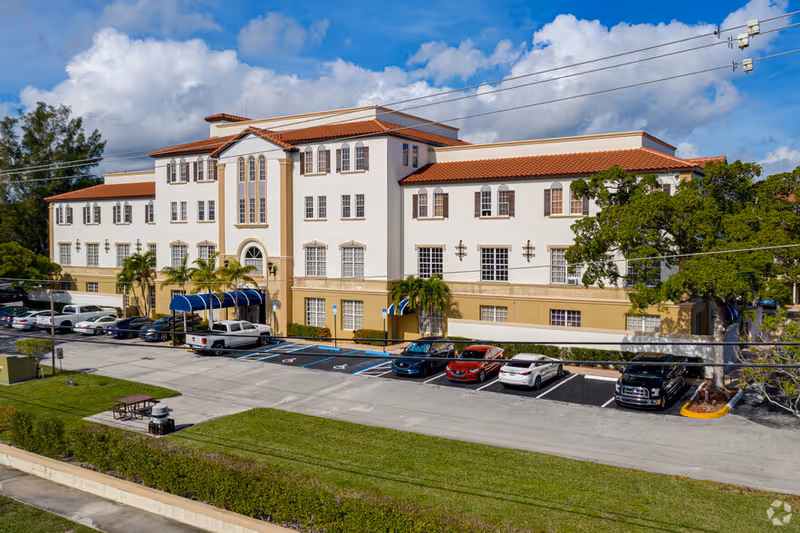 Exterior view of 365 In-Home Care Solutions facility with a parking lot.