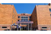 Brick facility with Linden Center for Nursing and Rehabilitation sign at a glass entrance.