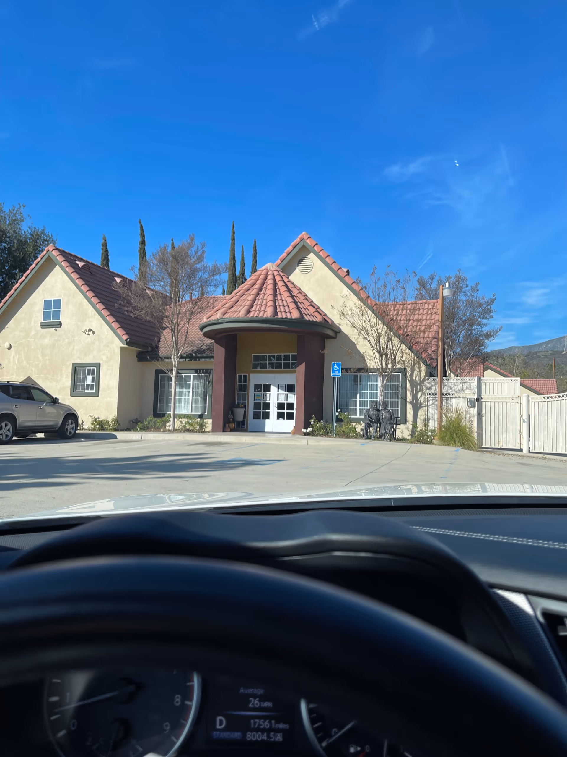 Exterior view of Mountain View Center with a rounded entryway and blue sky.