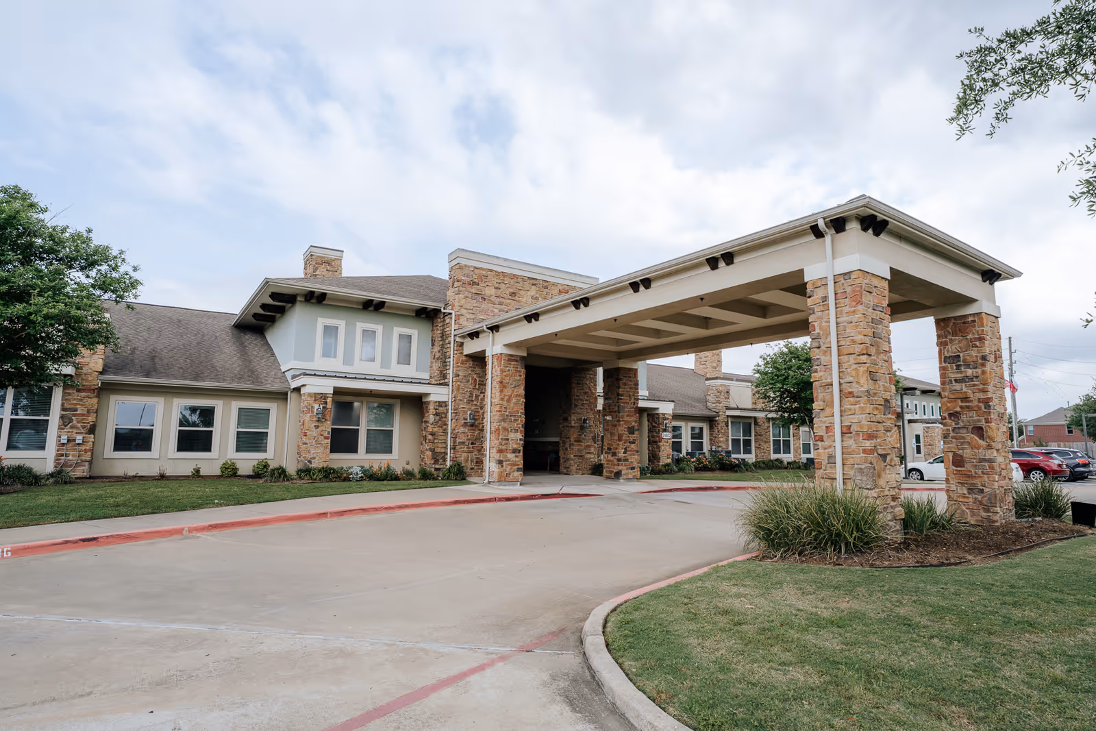 Exterior view of Caydance Assisted Living & Memory Care with covered entrance.