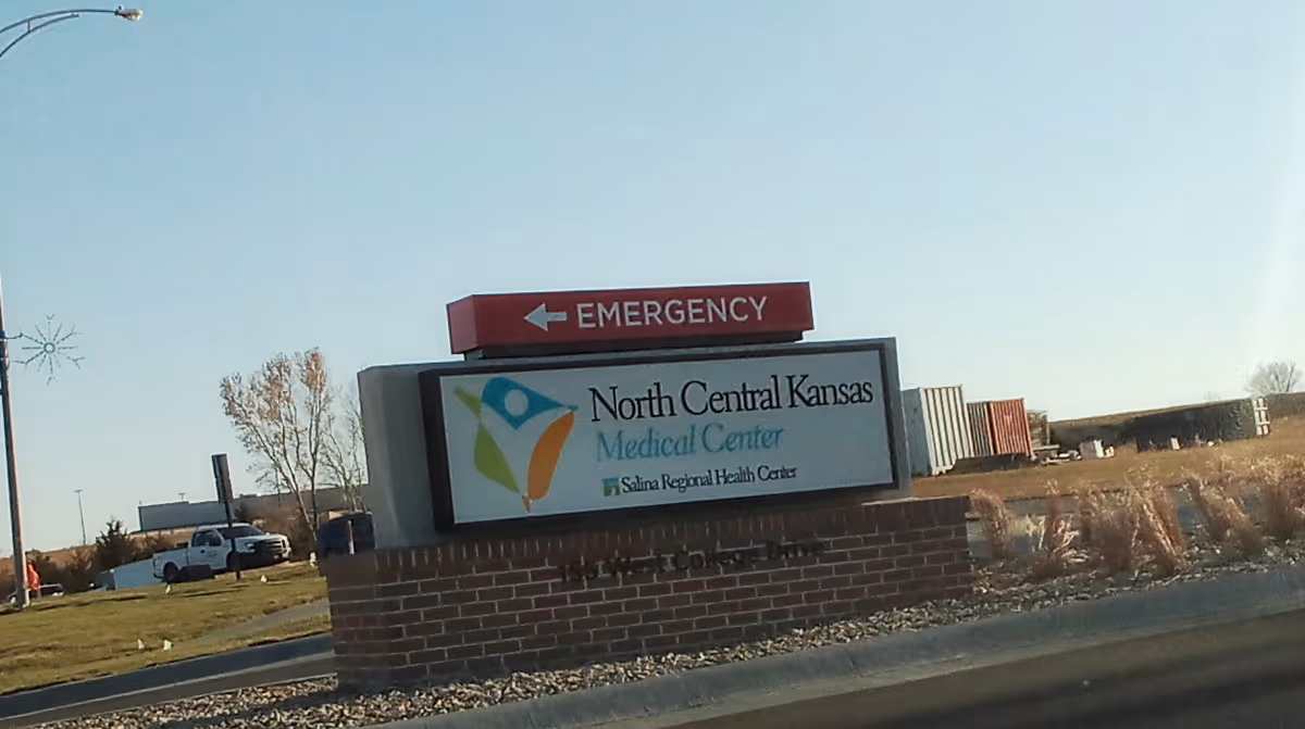 Exterior street view of the North Central Kansas Medical Center sign with emergency entrance marker