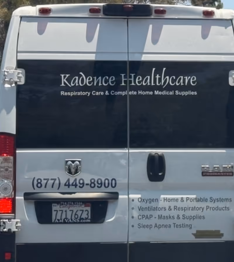 Rear Kadence Healthcare van displaying logo and contact information.