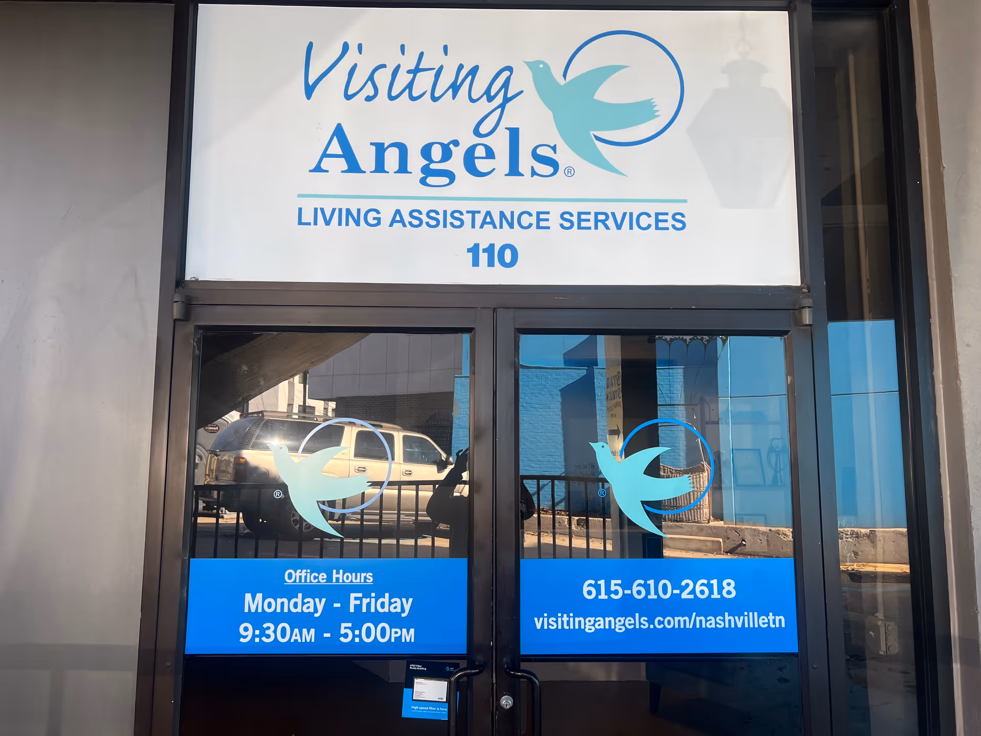 Front entrance of Visiting Angels Living Assistance Services with logo and 110.