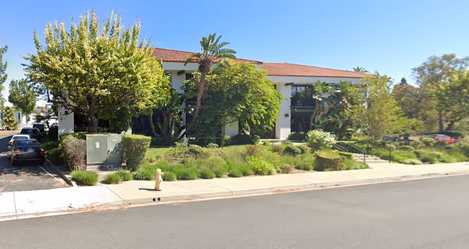Exterior view of Senior Helpers Thousand Oaks building with trees and landscaping.