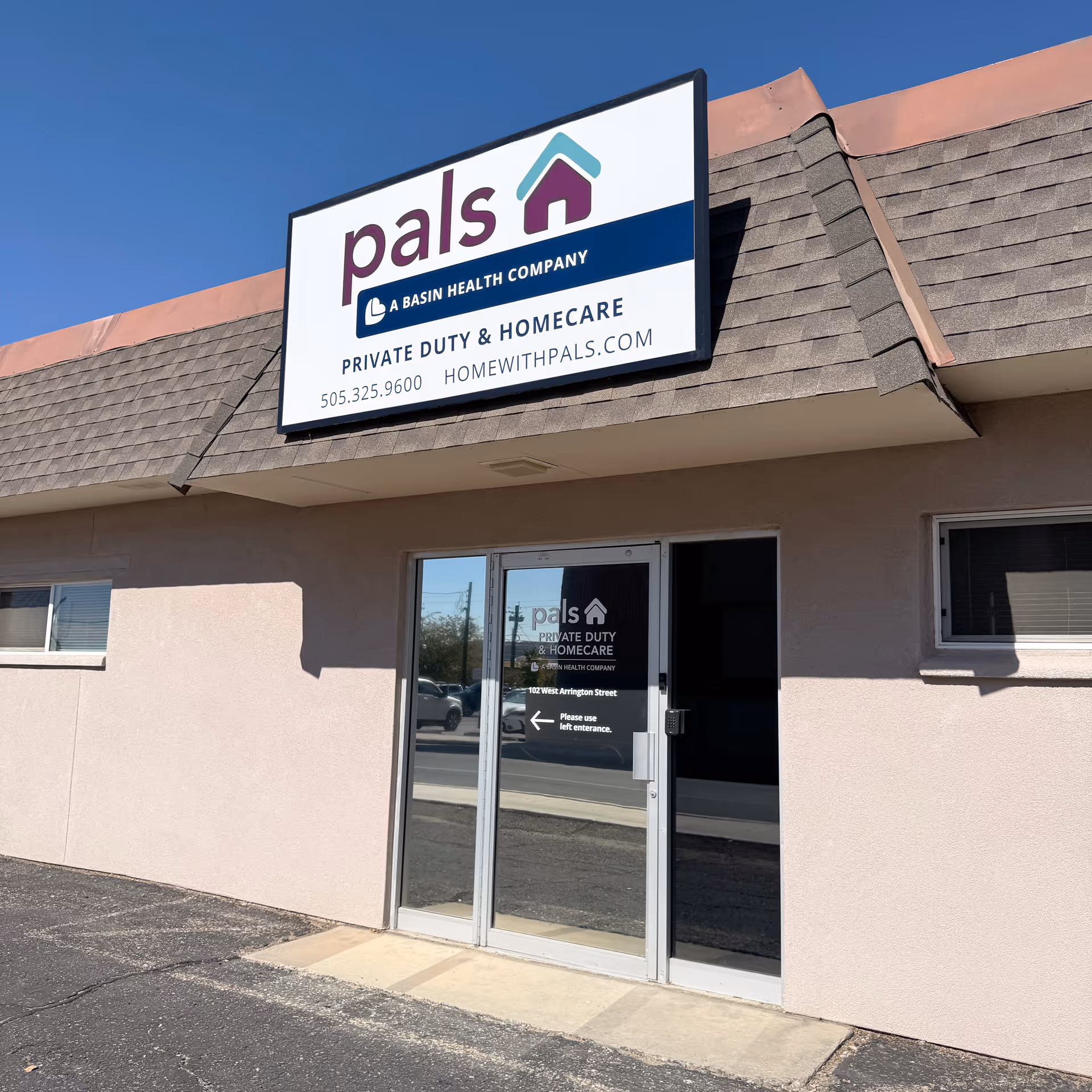 Exterior view of a beige building with a large sign reading 'pals' above the entrance.