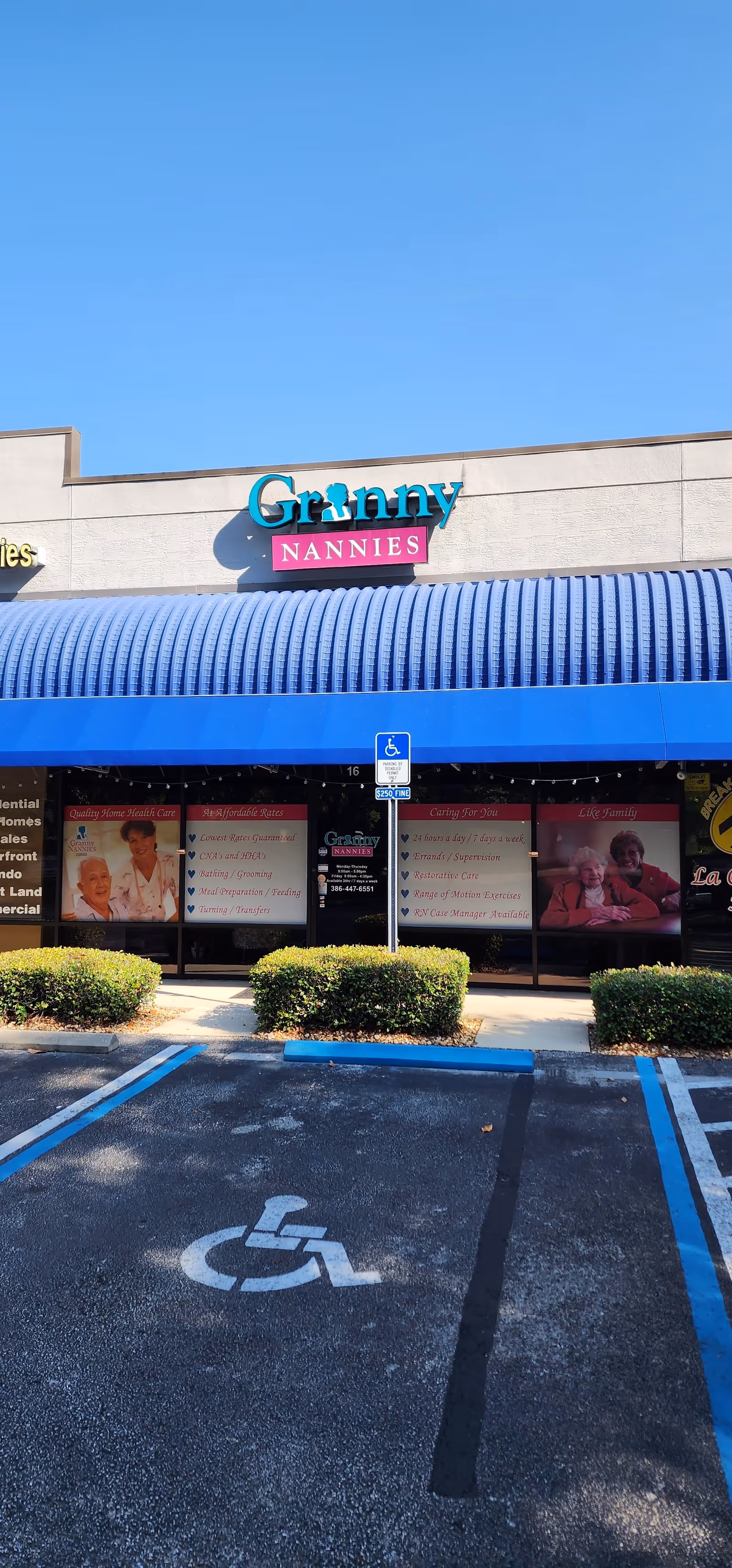 Granny Nannies storefront with blue awning and handicapped parking.