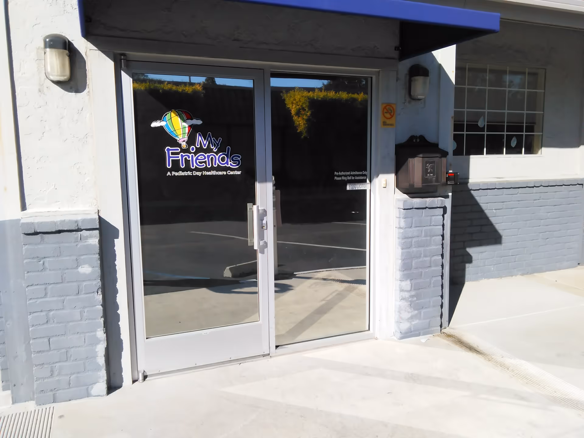 The entrance shows glass doors with 'My Friends' Pediatric Center signage.