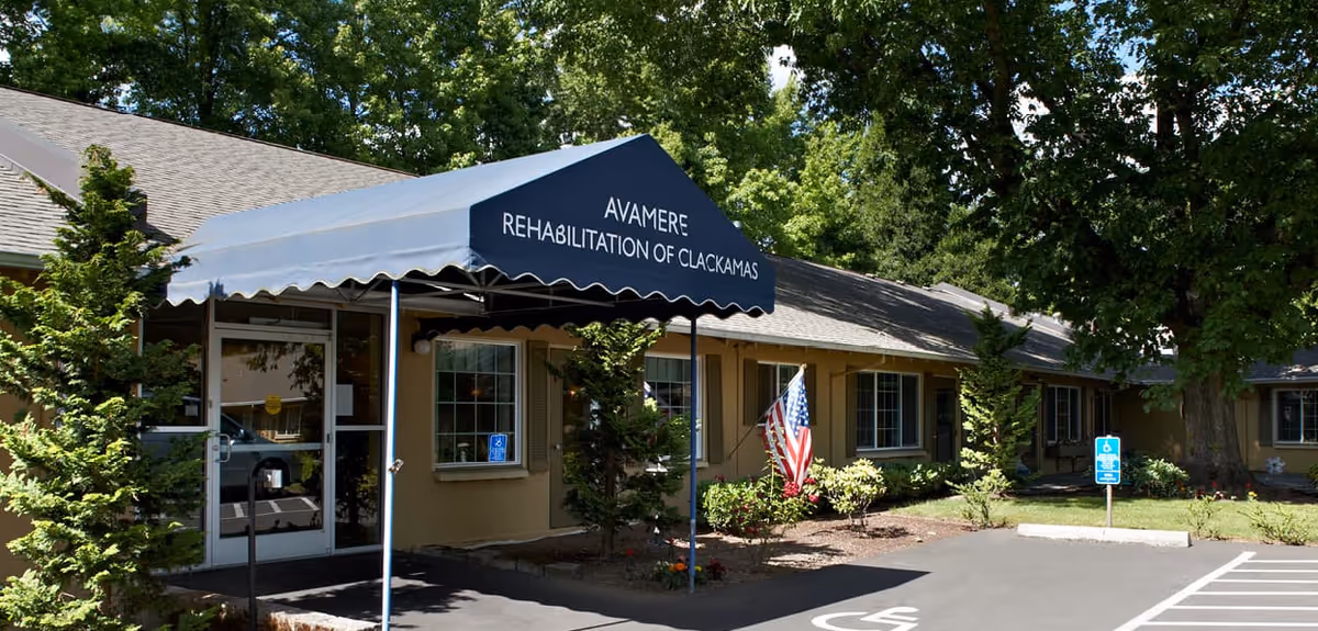 Front entrance of Avamere Rehabilitation of Clackamas under a blue canopy.