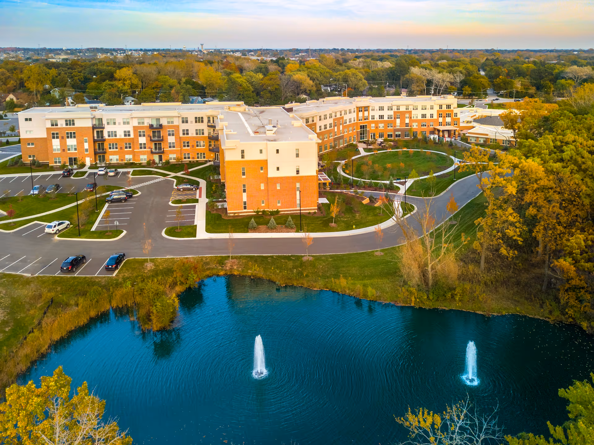 Aerial view of The Sheridan at Green Oaks campus with pond and fountains.