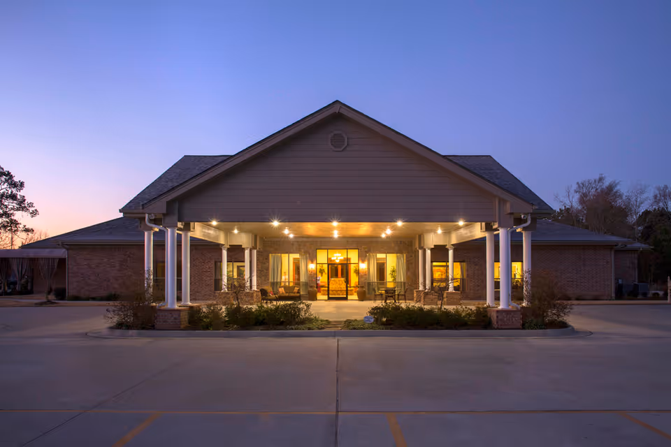 Front exterior of Lake Hamilton Health and Rehab with a lit covered entrance