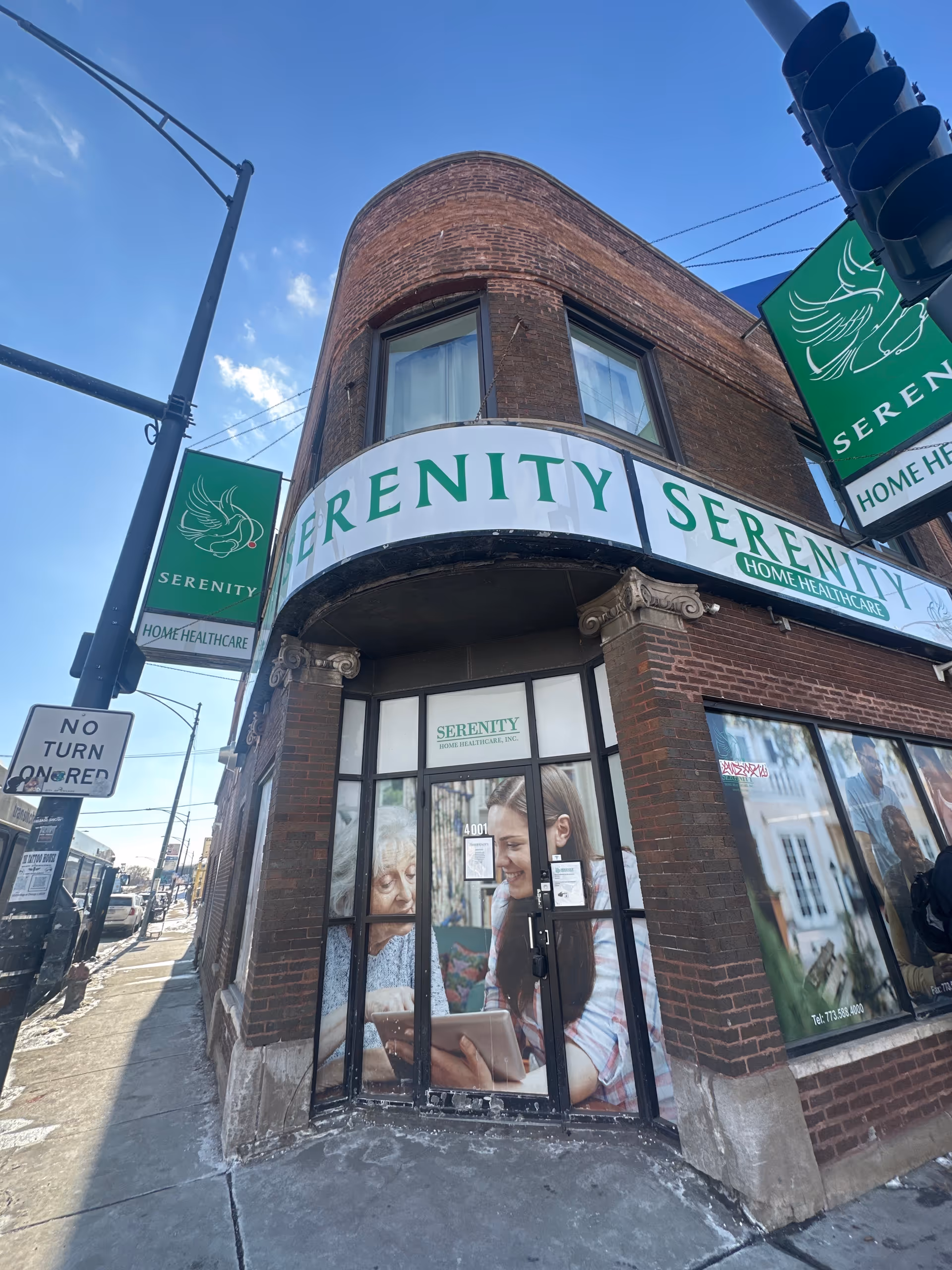 Exterior corner of Serenity Home Healthcare storefront with curved sign and glass doors.