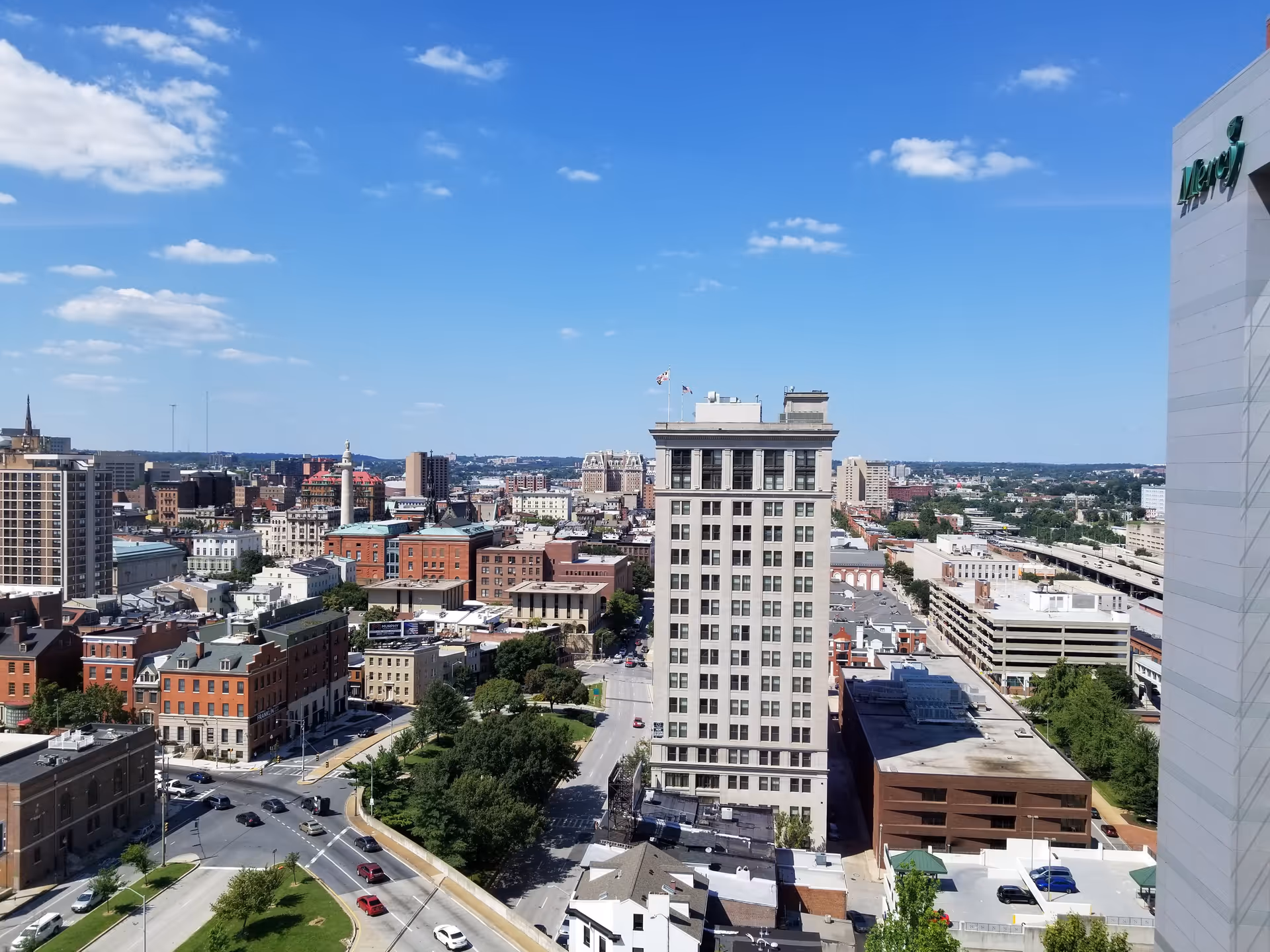 Aerial view of downtown with Mercy Medical Center sign on a tall white building