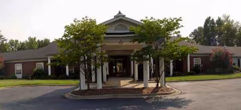 Brookdale Reynolda Road senior living facility exterior with a covered entrance and trees