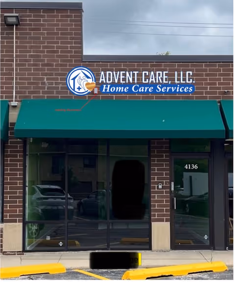 Exterior view of Advent Care, LLC storefront with green awning and glass doors.