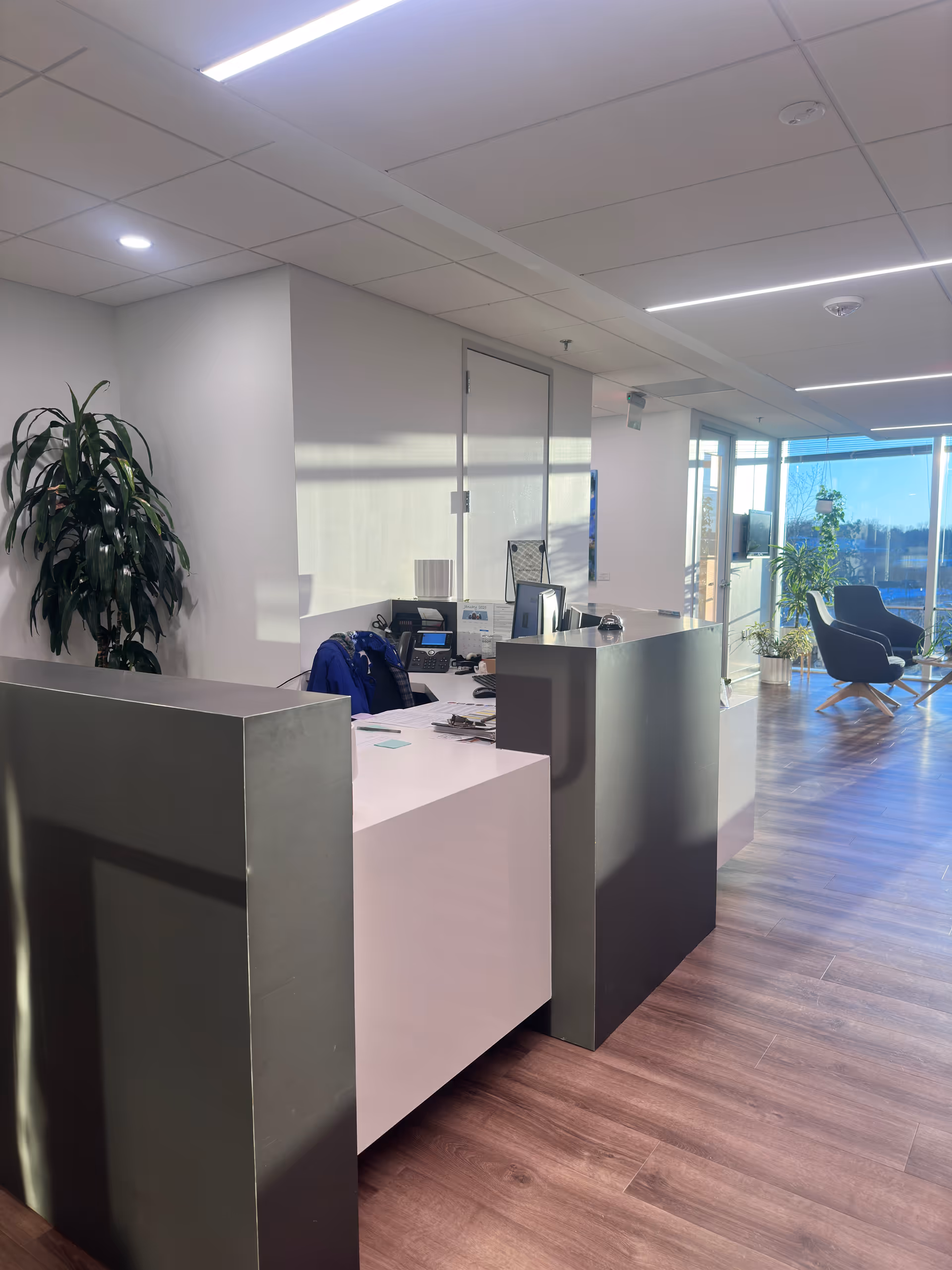 Reception area of Sahara Sewa Home Health Care with a modern desk and seating.