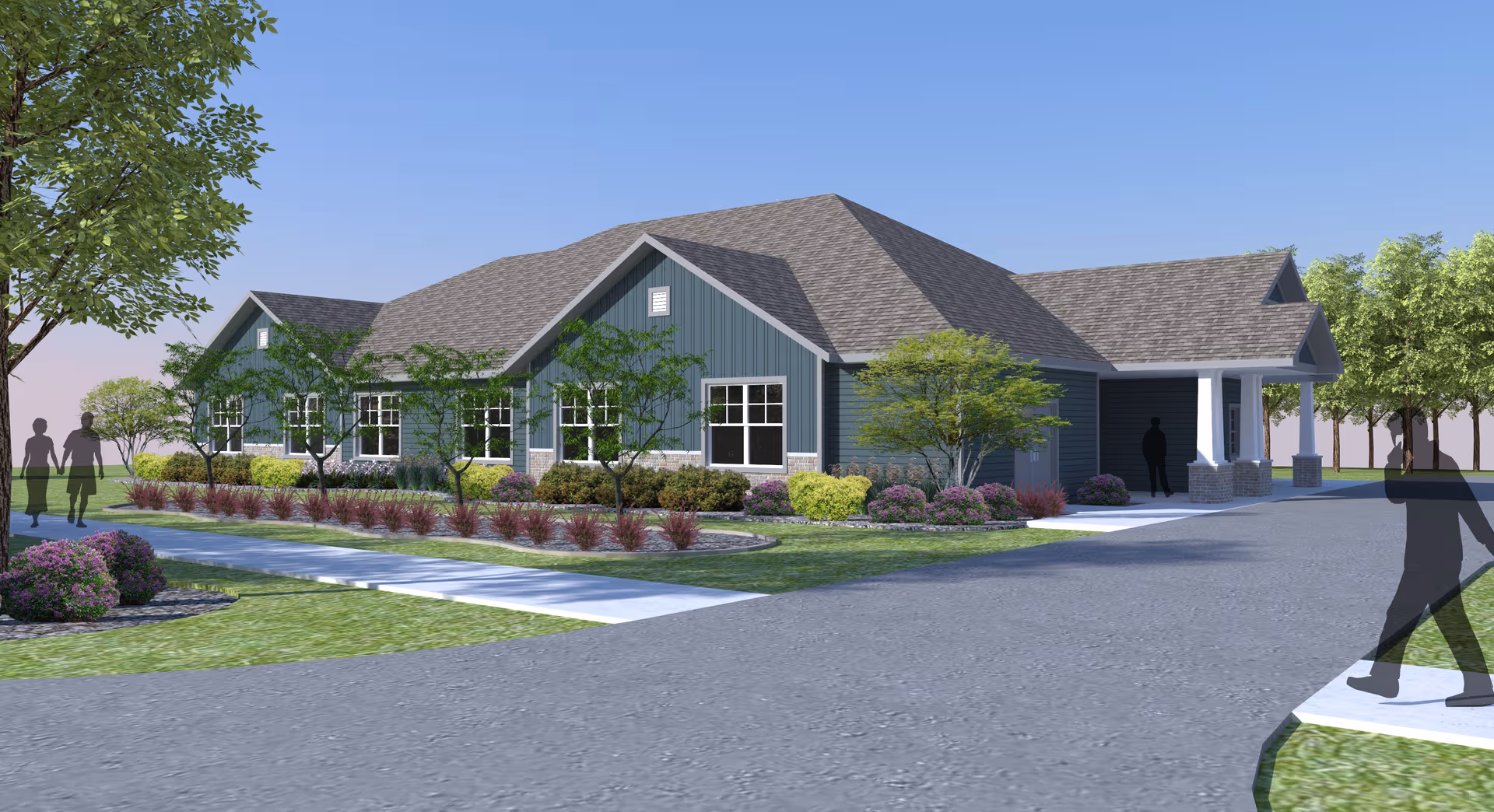 A modern single-story senior living facility with a blue exterior and landscaped entrance.