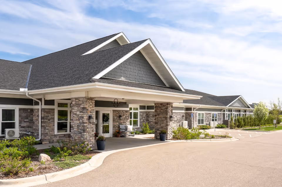 Exterior view of Rivers of Life facility with stone facade and covered entrance.
