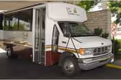 Life Care Center shuttle bus parked in front of a building.
