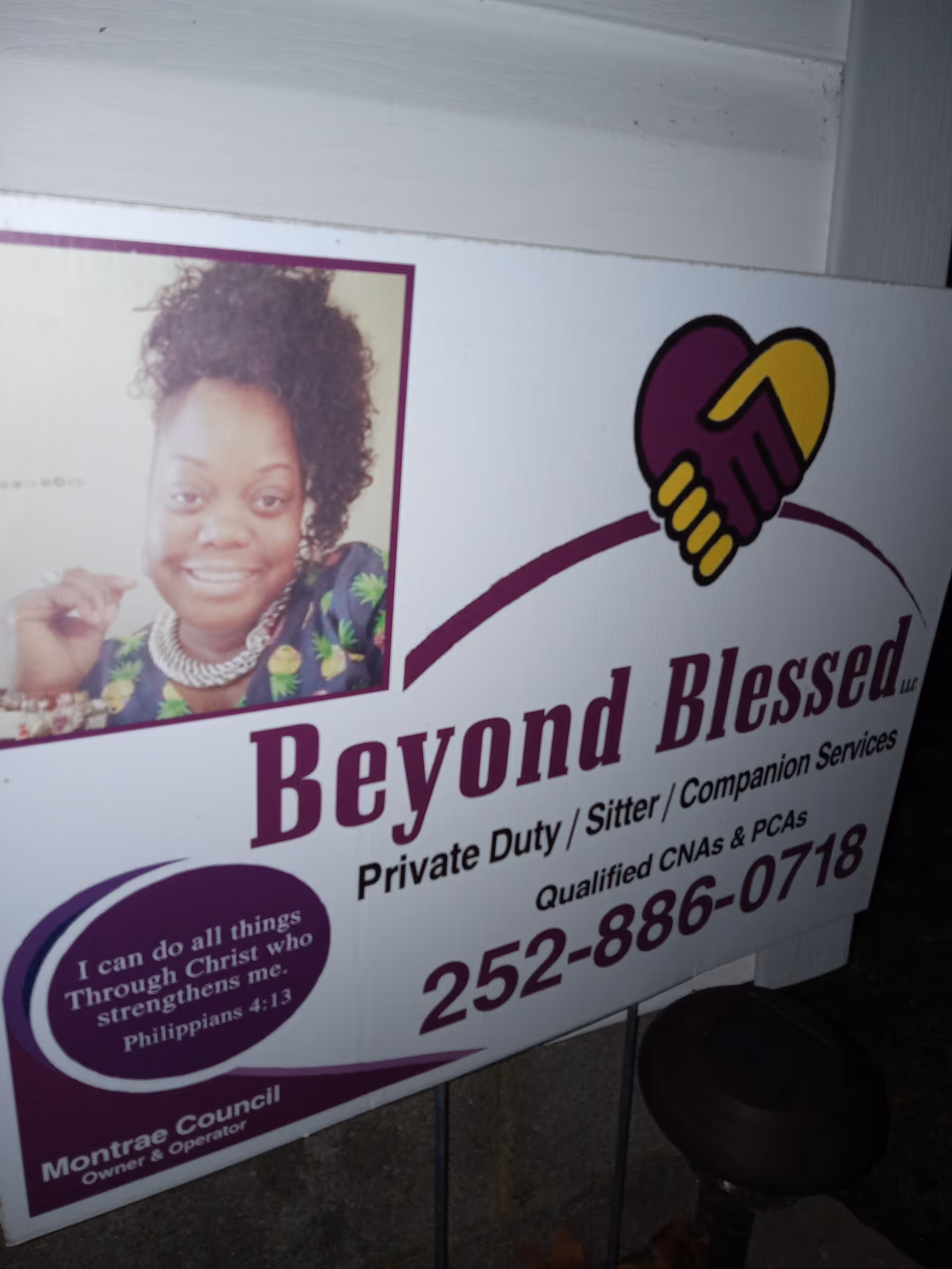 Outdoor sign advertising Beyond Blessed Private Duty Companion Services with a smiling woman portrait