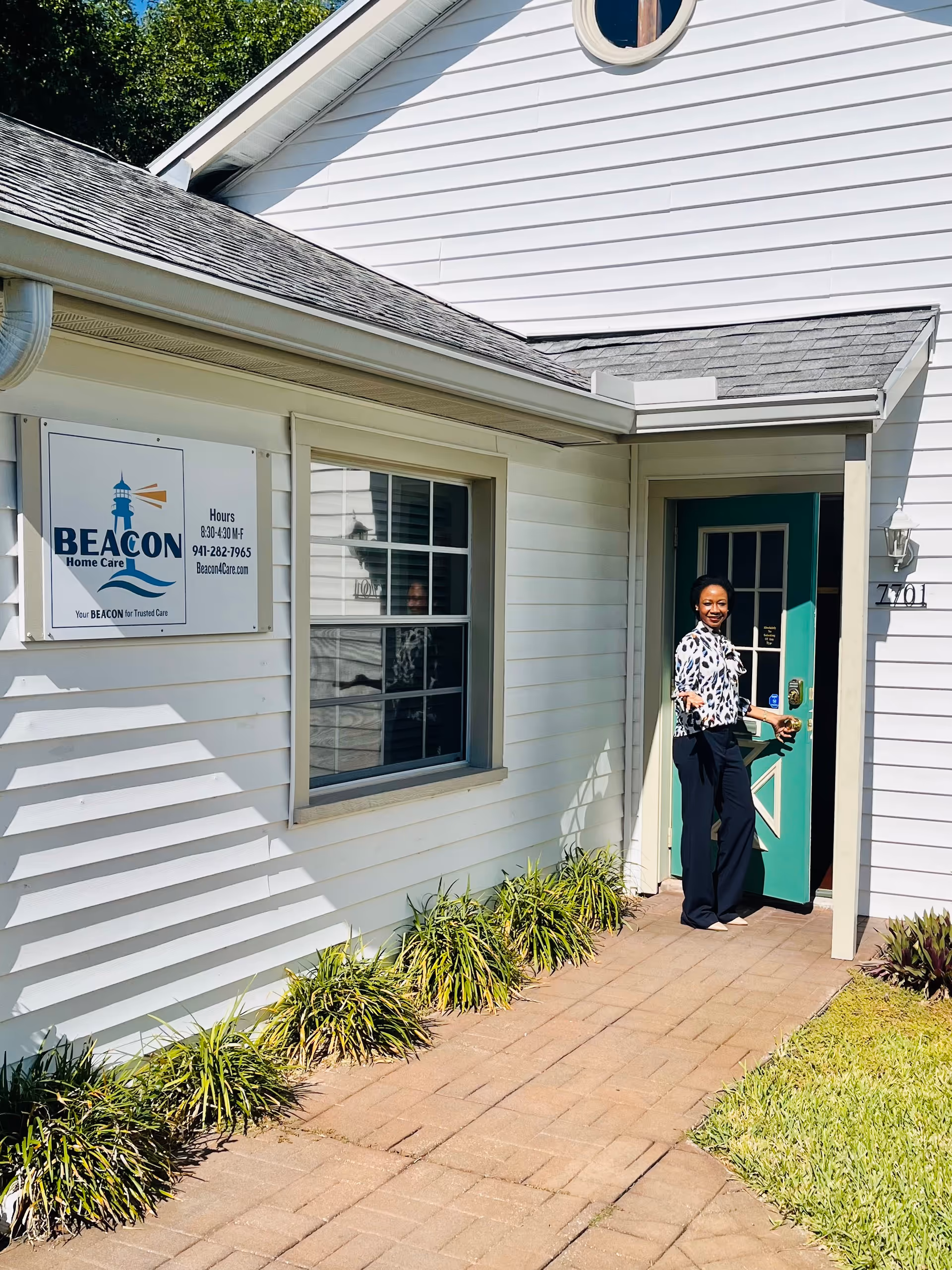 Exterior of Beacon Home Care building showing a woman at the front door.