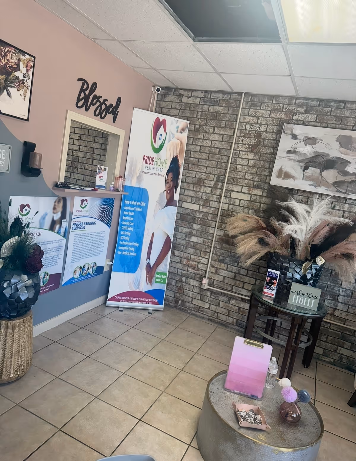Reception area with Pride Home Health Care banners, posters, and decor.