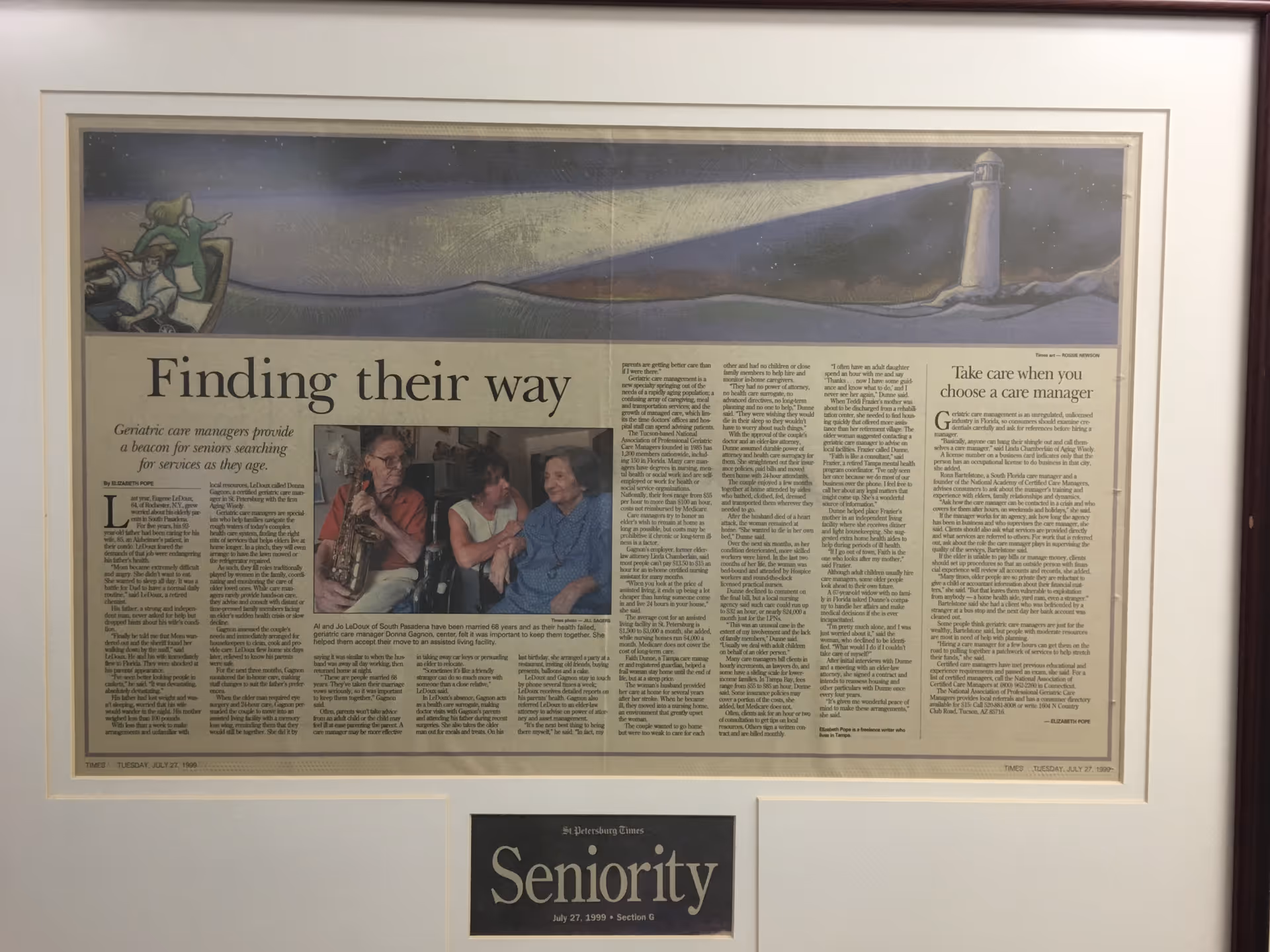 Framed newspaper article titled Finding their way mounted on a wall with a Seniority plaque.