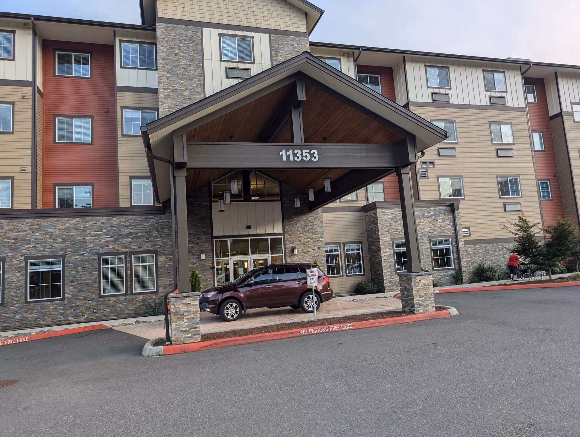 Front view of Fieldstone Memory Care Silverdale building with entry canopy and stone accents.
