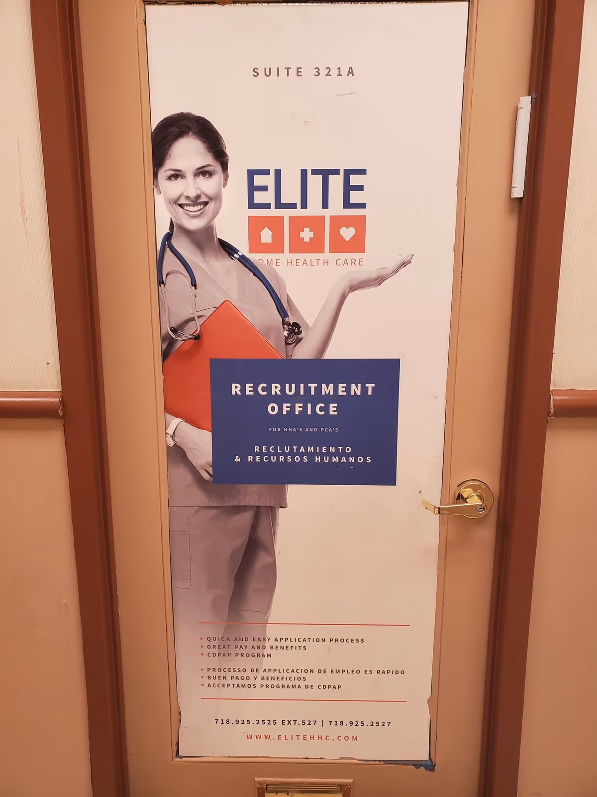 Door with a large Elite Home Health Care recruitment poster featuring a smiling nurse.