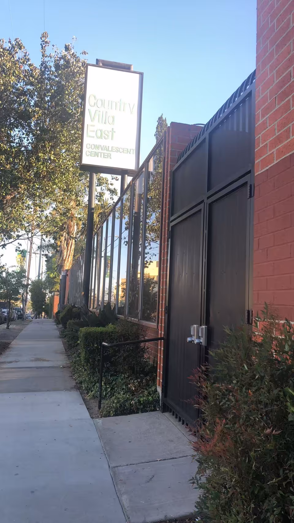 Exterior view of a brick building with a sign for East Terrace Rehabilitation & Wellness Centre.