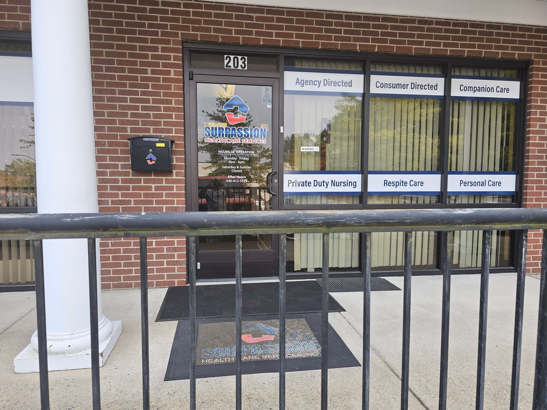 Exterior view of Surpassion Health Care Services entrance with signage.