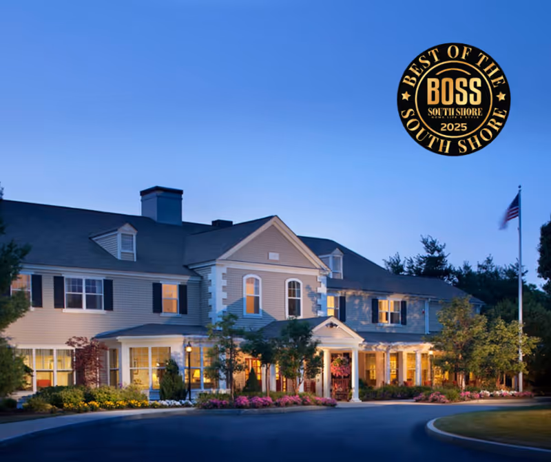 Exterior view of Allerton House Hingham senior living facility with landscaping and entry