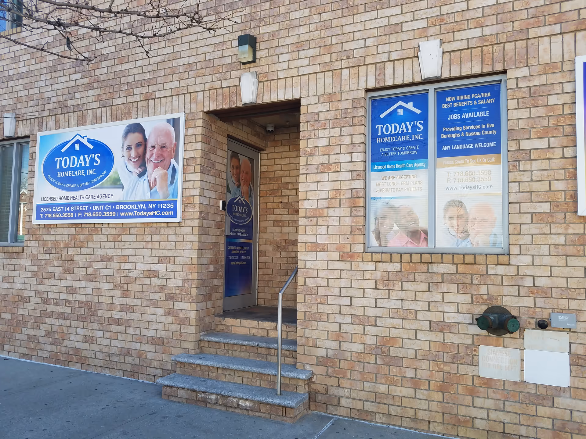 Brick building facade with Today's Homecare signs, entrance door, and steps.