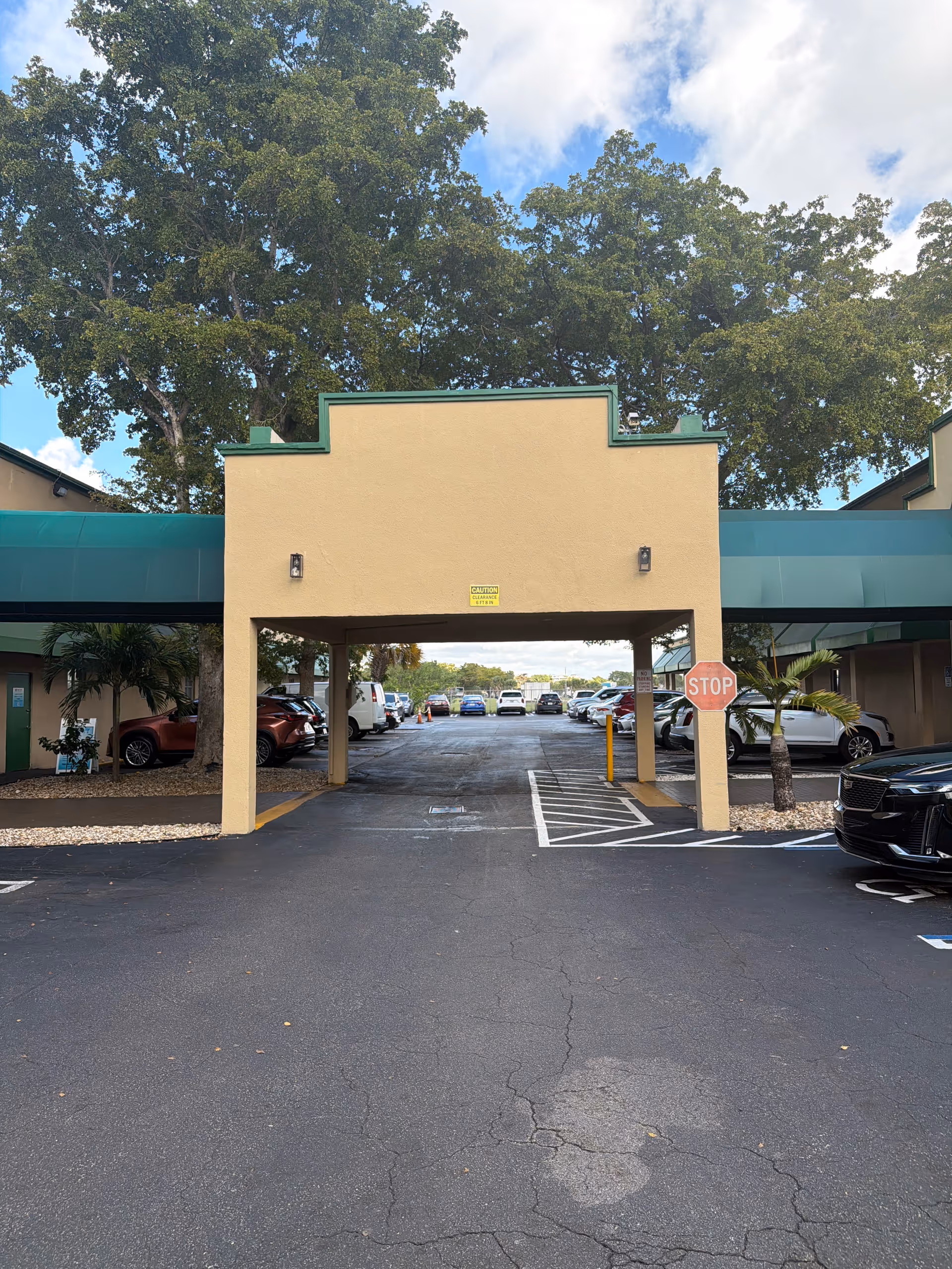 Exterior view of Wellness Home Health Services facility with covered entrance and parking lot.