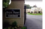 Exterior view of Bryn Mawr Extended Care Center sign near the entrance driveway.